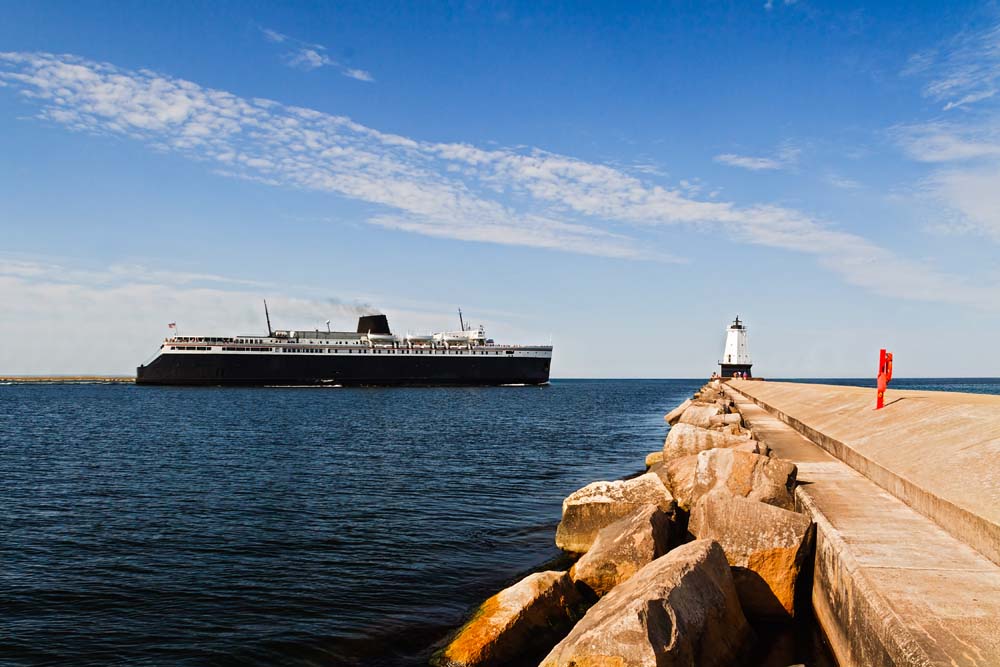 Large,Ship,,The,Ss,Badger,Car,Ferry,Coal-fired,Steamer,,Leaves Large ship, the SS Badger car ferry coal-fired steamer, leaves port and passes by the North Breakwater Light in Ludington, Michigan. | PCS Adventures
